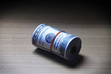 Roll of dollar on a table