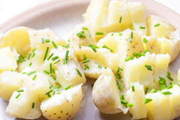 boiled unpeeled potatoes with chives