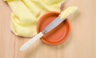 Gordijnen a butter on the knife © Roman Pyshchyk