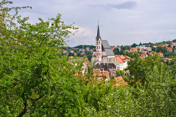 Fototapeta na wymiar St. Vitus Church from orchard, Cesky Krumlov, Czech Republic
