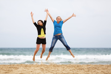 Two women jumping