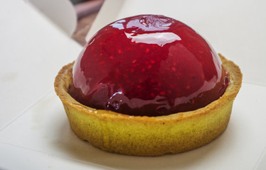 Strawberry tart on white close up