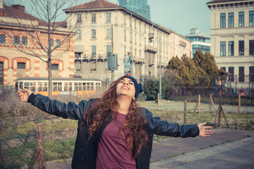 Beautiful girl posing in an urban context