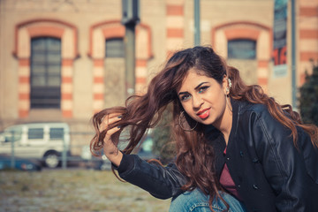 Fototapeta premium Beautiful girl posing in an urban context
