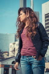 Beautiful girl posing in an urban context