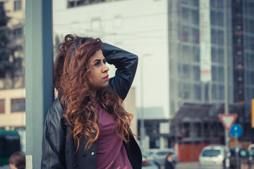 Beautiful girl posing in an urban context