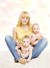 Fototapeta na wymiar Mother and Twins Baby Family Portrait, Mom with Little Children