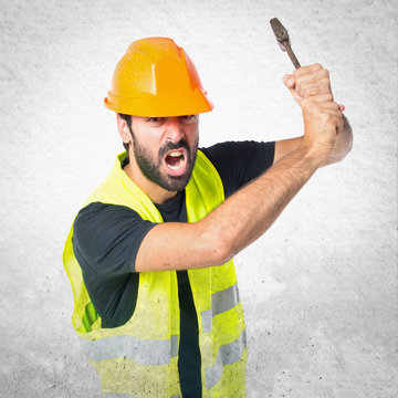 workman with wrench over white background