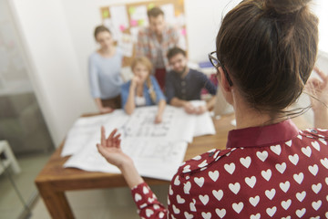 Conference with workers in boardroom