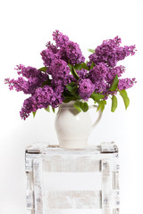 lilacs and lilies of the valley on a wooden crate - decoration