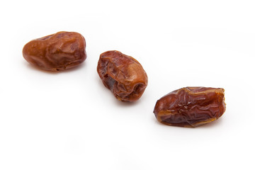 Medjool dates isolated on a white background.