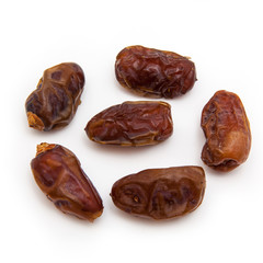 Medjool dates isolated on a white background.