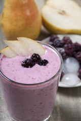 Fruit - berry smoothies with  pear and blackberry  with yogurt .