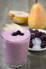 Fruit - berry smoothies with  pear and blackberry  with yogurt .