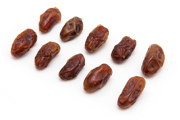 Medjool dates isolated on a white background.