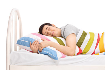 Man sleeping in a bed and dreaming sweet dreams