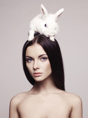 Beautiful woman with rabbit