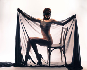 Naked girl covered with transparent cloth 