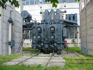 Fototapeta na wymiar Huge industrial high-voltage substation power transformer