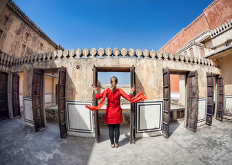 Woman opening door in Rajasthan