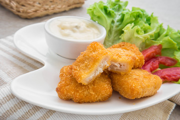 Fish nuggets and dip sauce on plate