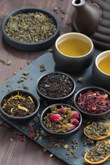 assortment of fragrant dried teas and green tea, top view