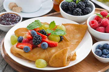 breakfast - crepes with fresh berries and honey