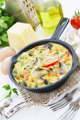 Omelet with mushrooms and tomatoes. Frittata