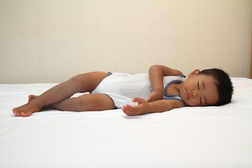 Obraz na płótnie Canvas 幼児(1歳児)の寝顔