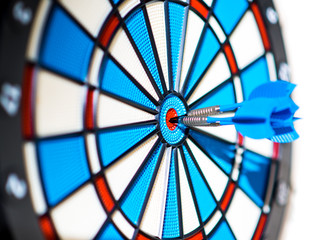 Success: dartboard and darts in bullseye
