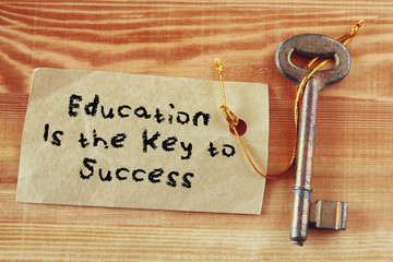 top view image of key with note and the phrase education is the 