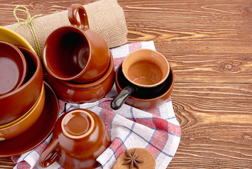 plates and cups on wooden table