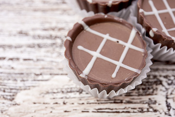 Dark chocolate on wooden background