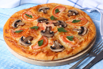 Vegetarian pizza with tomato and mushrooms