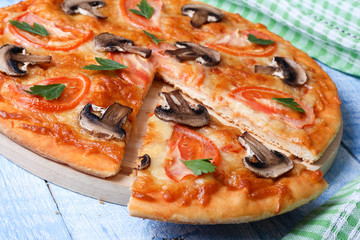 Vegetarian pizza with tomato and mushrooms