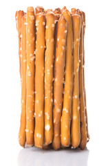 Brown, delicious pretzel sticks in a plastic container