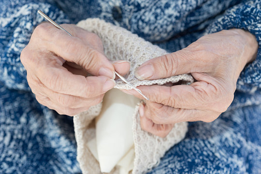 Hands elder crocheting