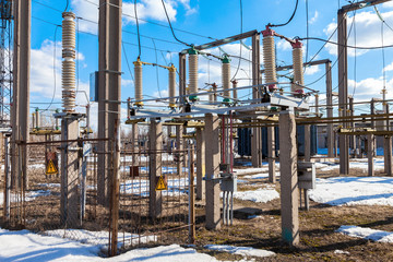 Part of high-voltage substation with switches in sunny day