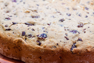 Side of cake with chocolate and nuts