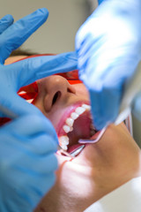 Obraz na płótnie Canvas Teeth treatment in the dentists / orthodontics office