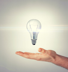 man hand with light bulb