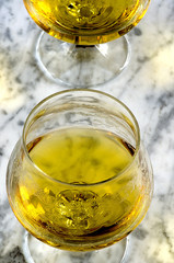 Glass of cognac on a marble table
