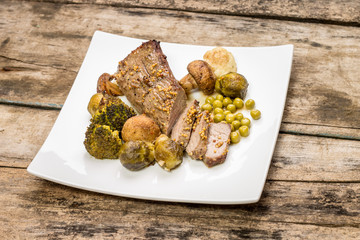 Roast beef cut in slice with brussels sprouts and mushrooms