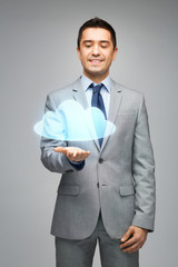 happy businessman showing virtual cloud projection