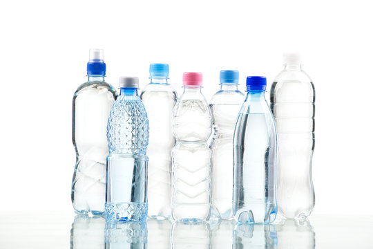 Different water bottles isolated on white