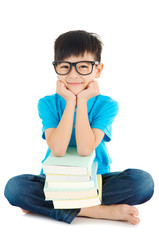 Asian school kid sitting on the floor with books