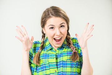 positive surprised teen girl with pigtails