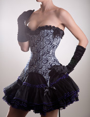 Attractive young woman in blue corset