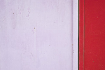 Old and rust pink and red metal door