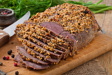 Cut pieces of baked meat on the table